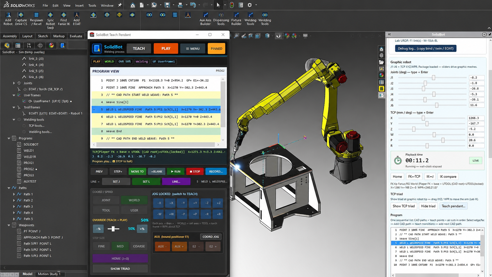 SolidBot generating a weld path with weave on a live SOLIDWORKS assembly, with the FANUC robot and teach pendant in view.